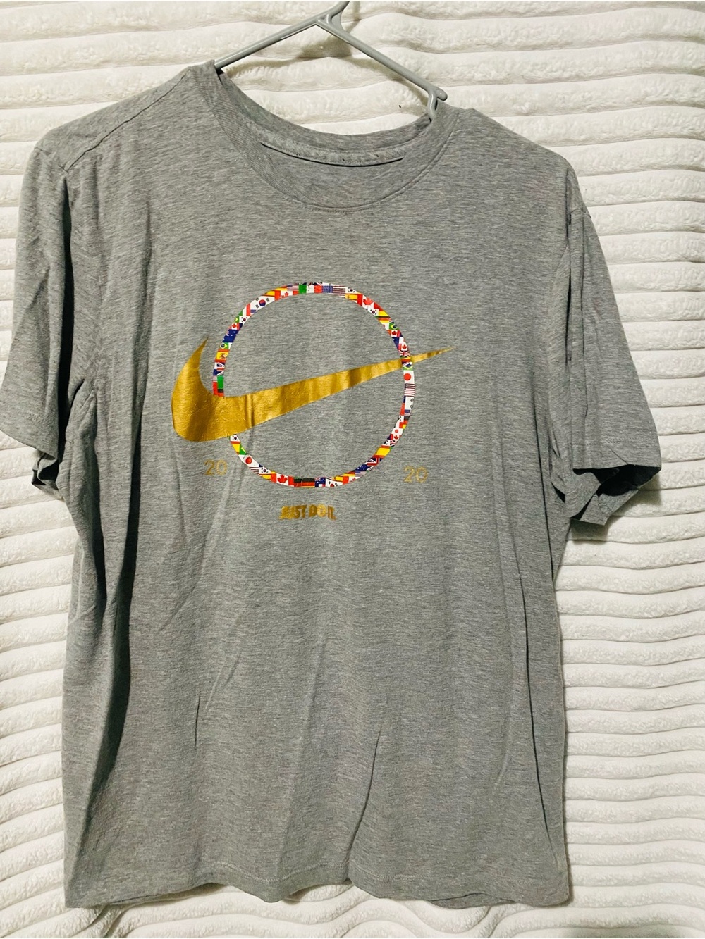 Nike Gray Short-Sleeve Tee with Gold Swoosh and Multicolor Flag Ring